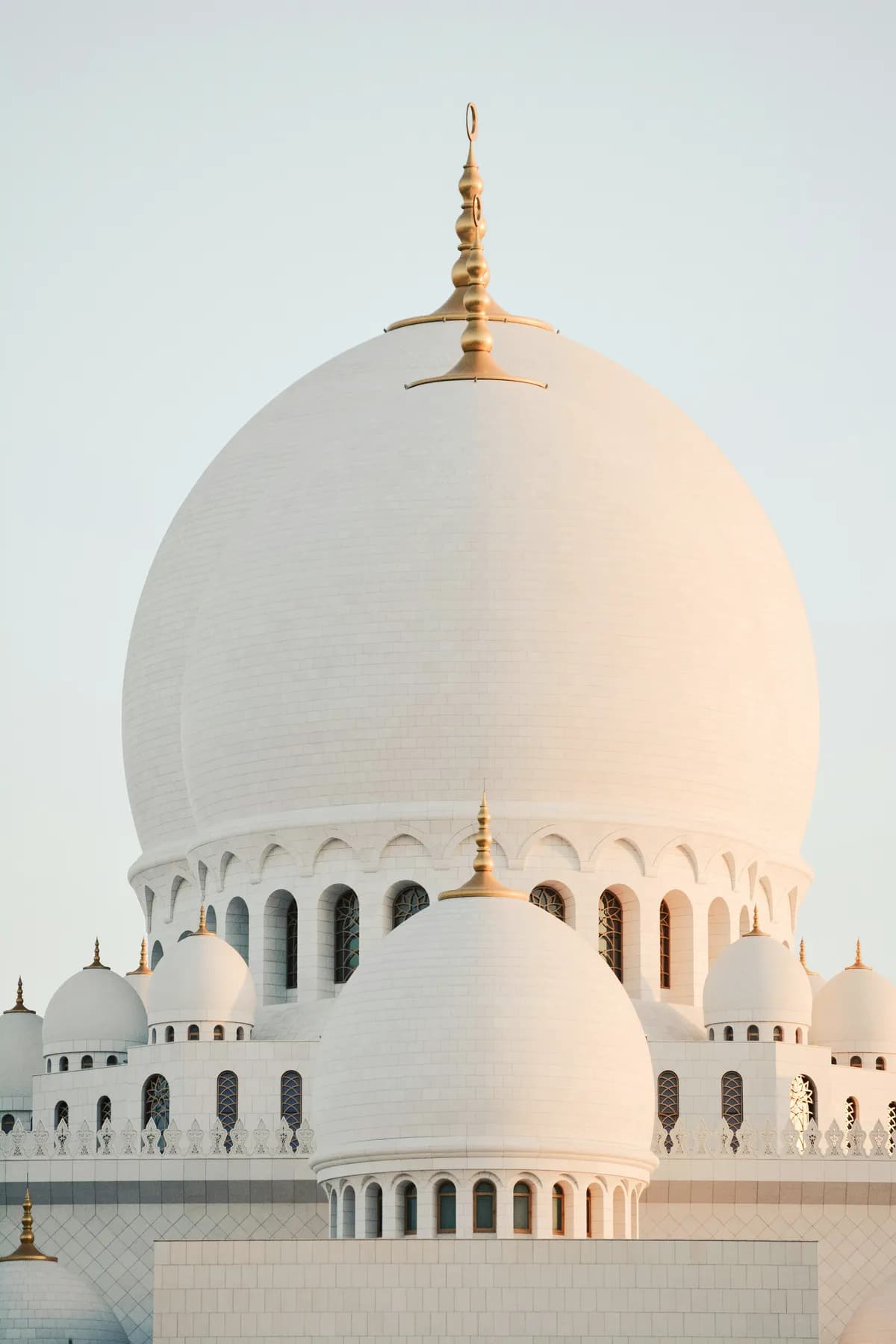 White mosque domes at sunrise